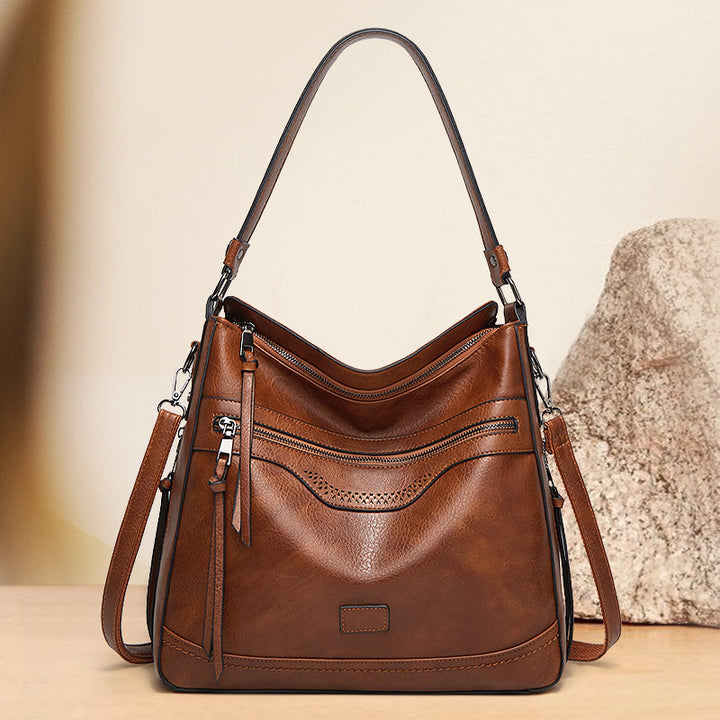 Malbjørg | Elegante Schultertasche mit wellenförmigem Design